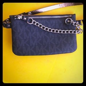 Black Michael Kors belted chain wallet.